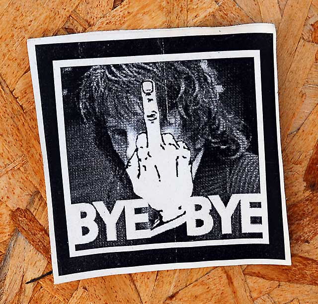 "Bye-Bye" (with finger) - sticker on a temporary wooden wall at a salvage yard in the Sunset Junction area east of Hollywood