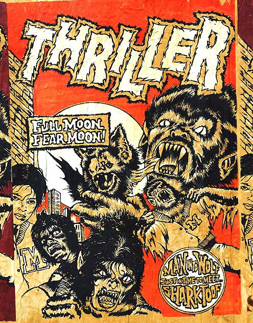 "Thriller" - art poster on a temporary wooden wall at a salvage yard in the Sunset Junction area east of Hollywood