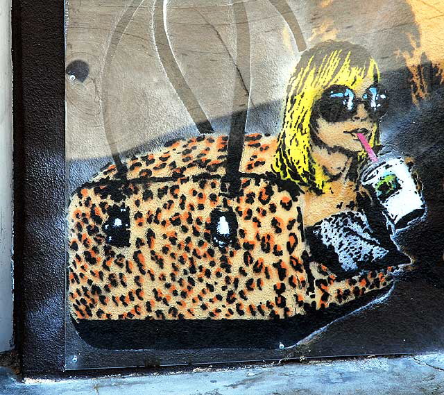 Woman in Leopard Skin Pet Carrier - graphic under plastic on Sunset Boulevard, Hollywood