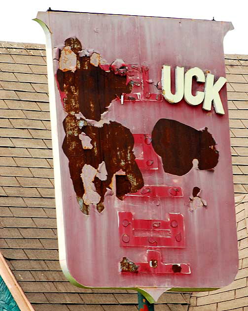 "UCK" - damaged restaurant sign on Heliotrope at Melrose Avenue