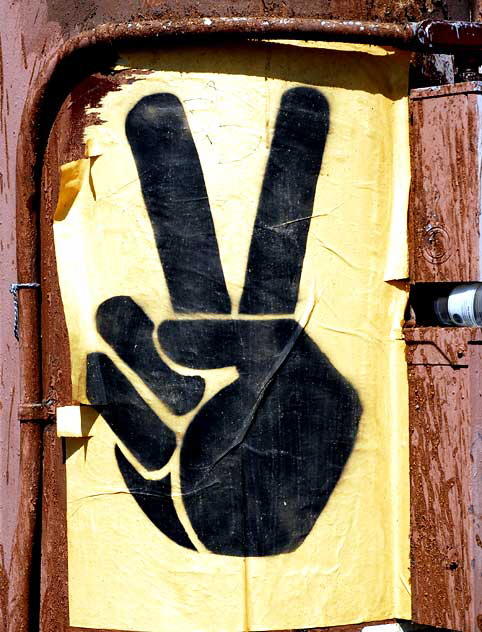 Poster on billboard support where Sunset and Hollywood Boulevard cross - V-Sign
