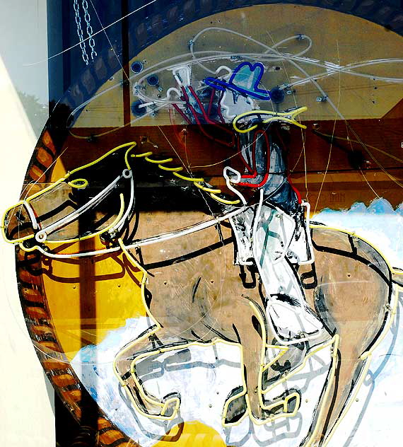 Neon cowboy in the window of "Off the Wall" - Melrose Avenue