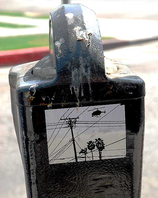 Parking meter with helicopter sticker, West Sunset Boulevard at Edgecliff