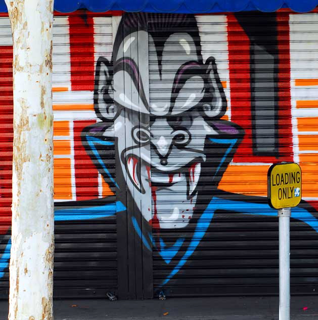 Newsstand on the east wall of London Boots, Melrose Avenue at Martel - vampire and acacia tree