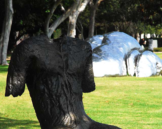 "Sitting Figure on a Short Bench" (2000) by the Polish artist Magdalena Abakanowicz  at Santa Monica Boulevard and Crescent Drive, Beverly Gardens Park, Beverly Hills