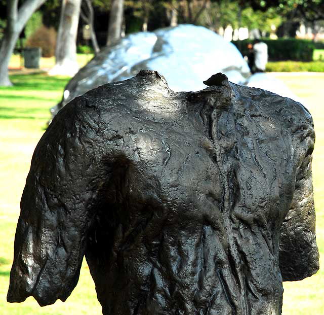 "Sitting Figure on a Short Bench" (2000) by the Polish artist Magdalena Abakanowicz  at Santa Monica Boulevard and Crescent Drive, Beverly Gardens Park, Beverly Hills