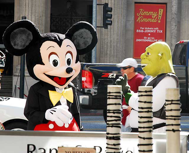 Mickey Mouse and Shrek, impersonators hanging out on Hollywood Boulevard, Friday, October 30, 2009