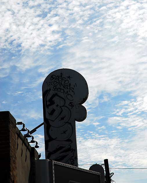 Odd light on a November Monday in Hollywood - graffiti on old marquee, Las Palmas 