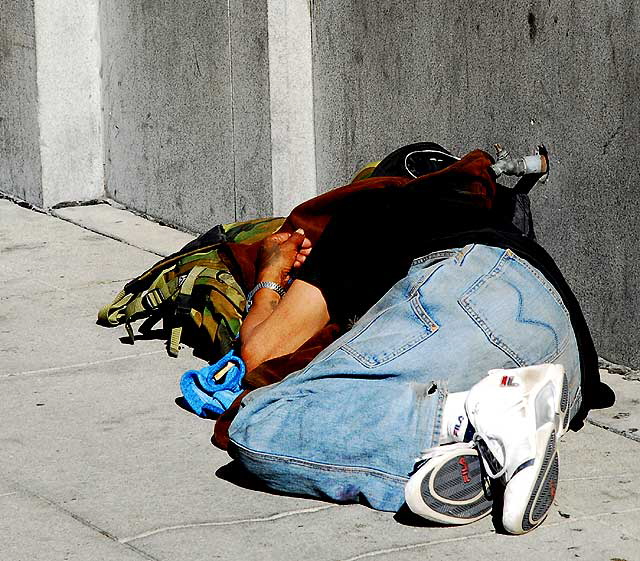 Homeless sleeper, north wall of the historic First National Bank of Hollywood, Hollywood and Highland