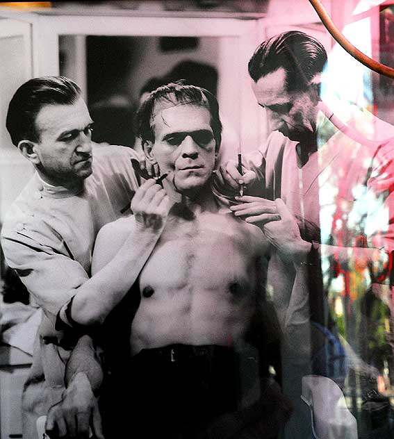 Rare photo in window of Edmunds Books, Hollywood Boulevard - applying the makeup to the original Frankenstein