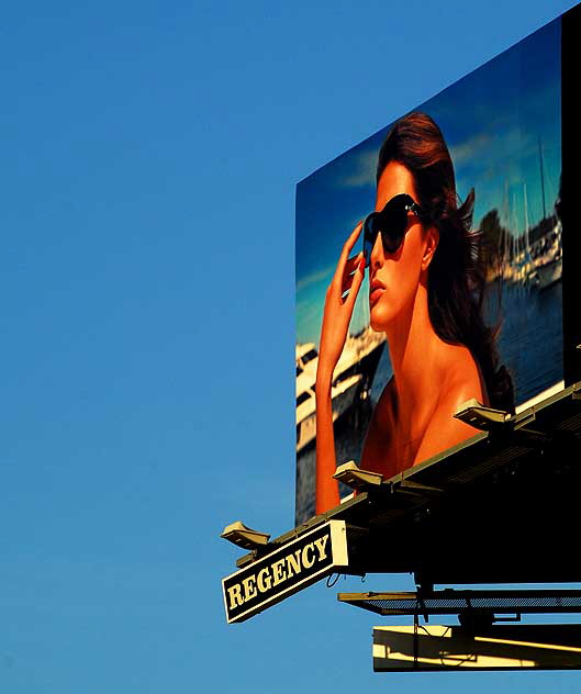 Sunglasses - Louis Vuitton billboard above Sunset Plaza