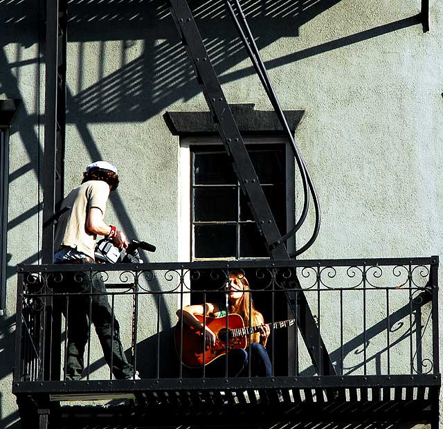 Video shoot, singer with guitar on a Hollywood balcony at Yucca and Wilcox, Wednesday, December 2, 2009 