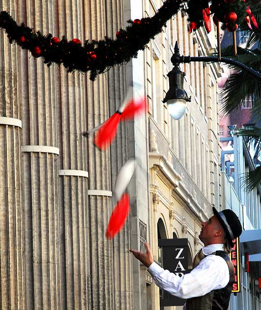 Christmas juggler on stilts, El Capitan Theater, Hollywood Boulevard
