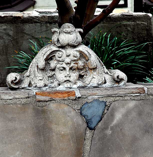 Stone Bench in the gardens of the Crossroads of the World, Sunset Boulevard at Cherokee 