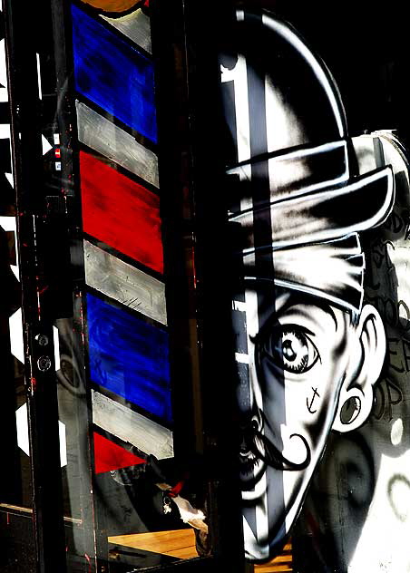 Window of combination barbershop and tattoo parlor one Melrose Avenue 