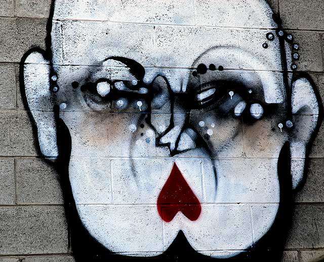 : Face painted on concrete block wall, Hollywood