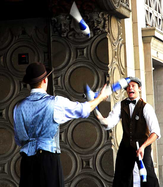 Two jugglers on stilts at the El Capitan Theater on Hollywood Boulevard