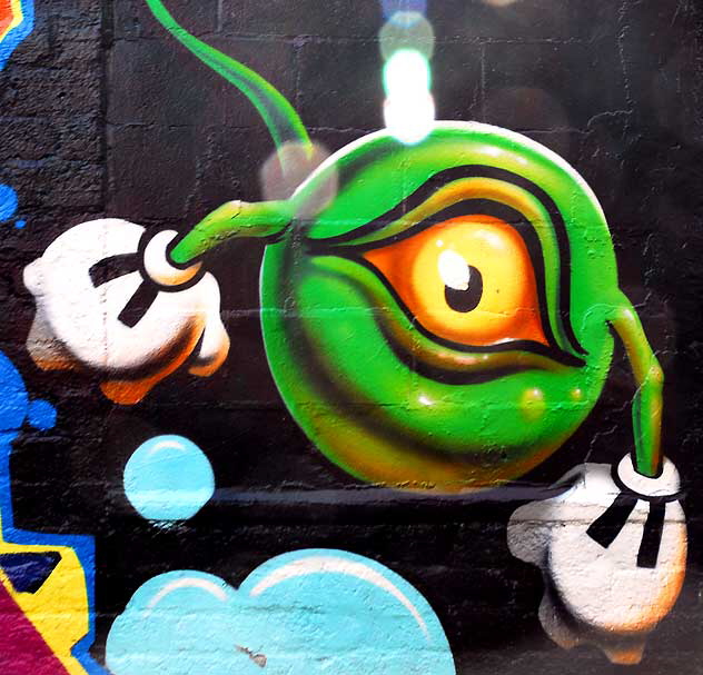 One-eyed zygote (with gloves) - graffiti wall in alley behind Melrose Avenue 