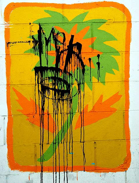 Defaced palm painting in alley behind Melrose Avenue
