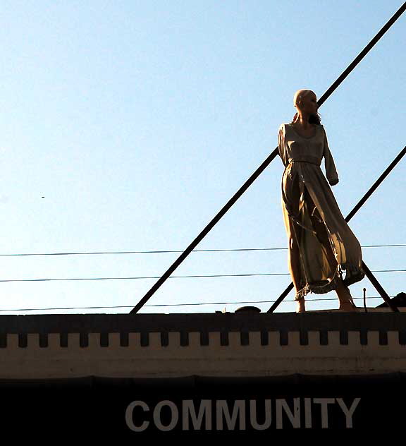 Figure on roof of Community Thrift Store, Fairfax Avenue, Los Angeles