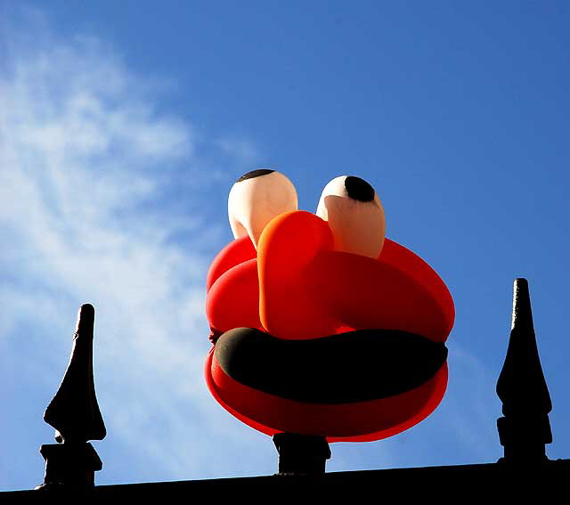 Balloon Man tied to wrought iron fence at the Lido Apartments, on the southwest corner of Wilcox and Yucca in Hollywood, Thursday, January 14, 2010