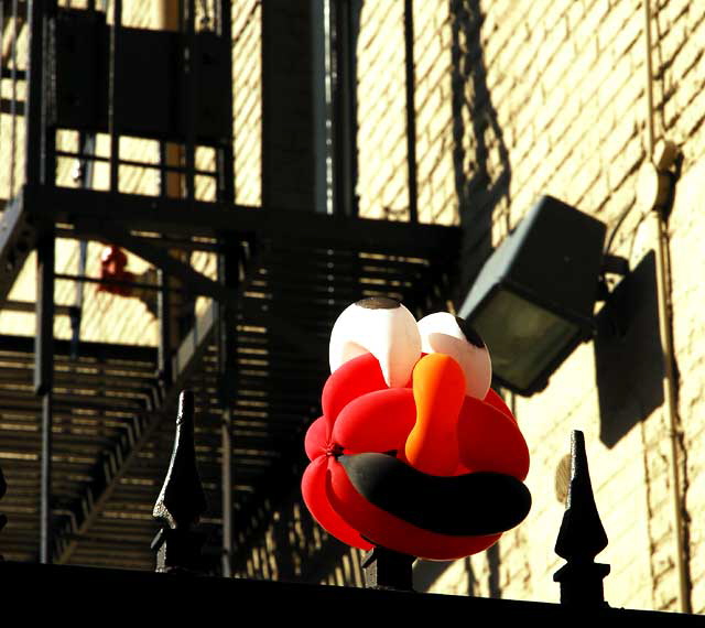 Balloon Man tied to wrought iron fence at the Lido Apartments, on the southwest corner of Wilcox and Yucca in Hollywood, Thursday, January 14, 2010