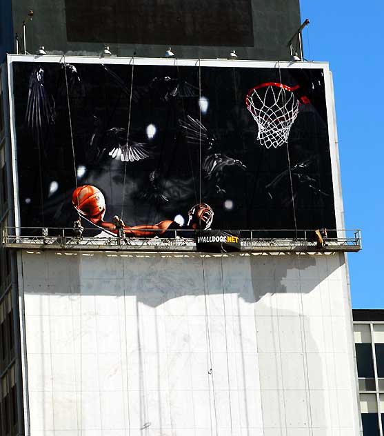"Basketball" supergraphic being installed over Wilshire Boulevard