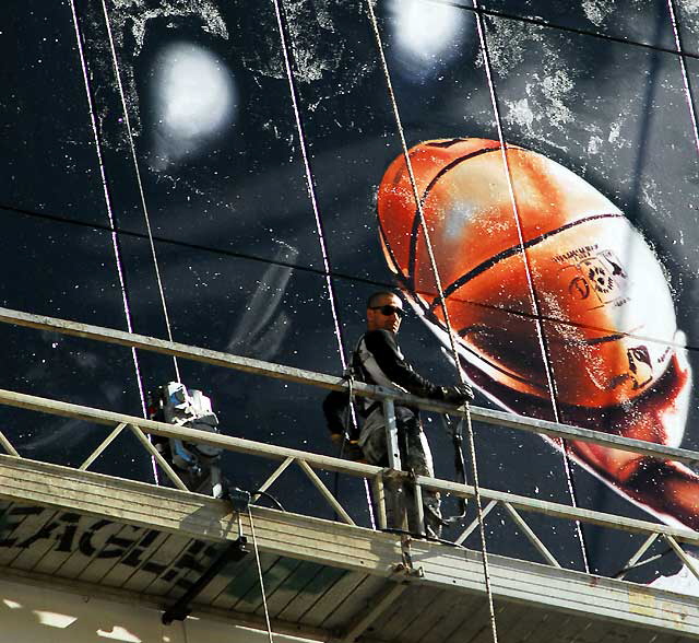 "Basketball" supergraphic being installed over Wilshire Boulevard