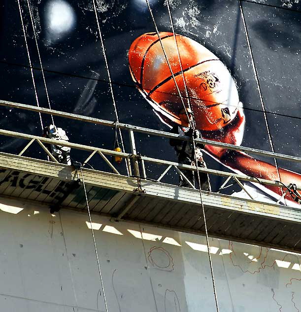 "Basketball" supergraphic being installed over Wilshire Boulevard