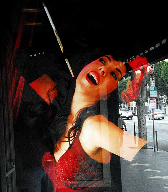 Red woman with cigarette holder, window on Hollywood Boulevard Red woman with cigarette holder, window on Hollywood Boulevard