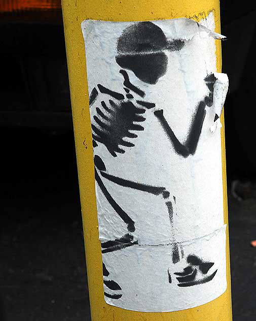 Punk Skeleton - sticker on yellow pole, Hollywood Punk Skeleton - sticker on yellow pole, Hollywood
