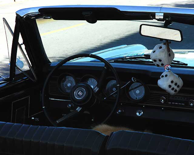 1967 pearl white Mercury Comet Caliente convertible, with fuzzy dice, parked on Selma in Hollywood