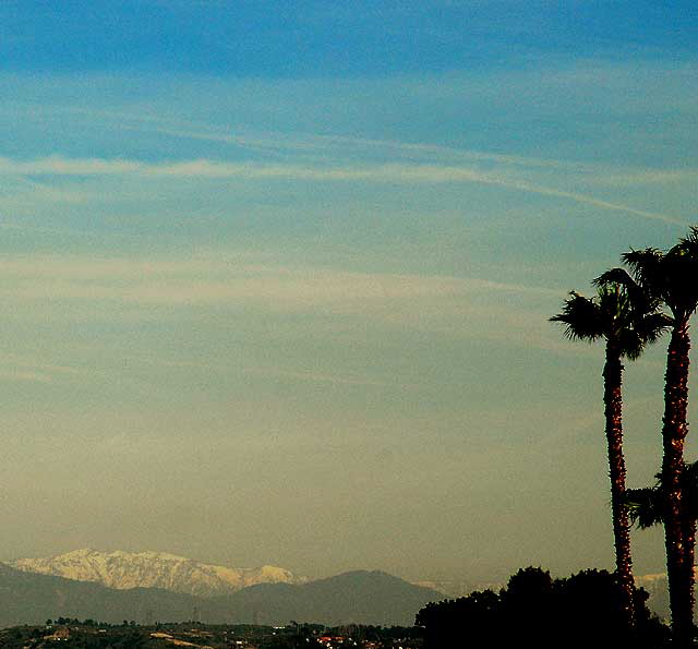 From the bridge over the mole at Playa Del Rey, Hollywood in the mid-range, and the snow-covered San Bernardino Mountains in the far distance