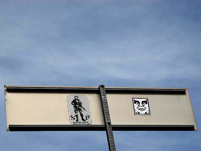 Two faces on street sign…