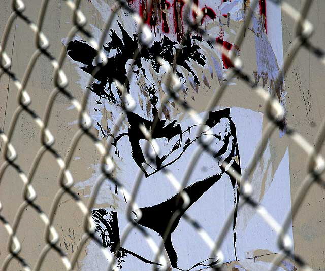 Poster of couple kissing behind chain link fence, Sunset Boulevard and Gordon, Hollywood