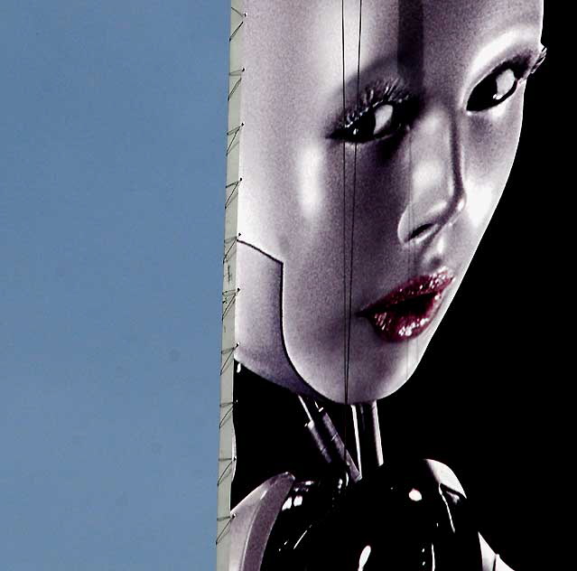 The neon robot-lady hawking vodka high above Hollywood and Highland 