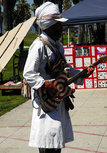 The man in a turban on roller-skates who scoots around playing his guitar right in your face in Venice Beach