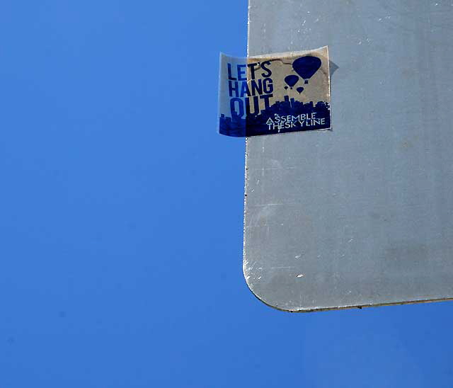 Let's Hang Out: Assemble the Skyline - sticker on street sign, Sunset Boulevard at Vista Street, Hollywood