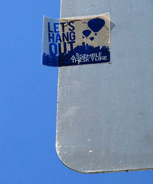 Let's Hang Out: Assemble the Skyline - sticker on street sign, Sunset Boulevard at Vista Street, Hollywood