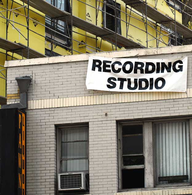 Recording studio above a combination pawn shop and liquor store on the southwest corner of Hollywood Boulevard and La Brea