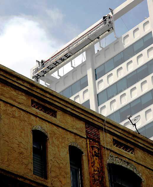 Workers above the Christie Lee apartments, Hollywood 