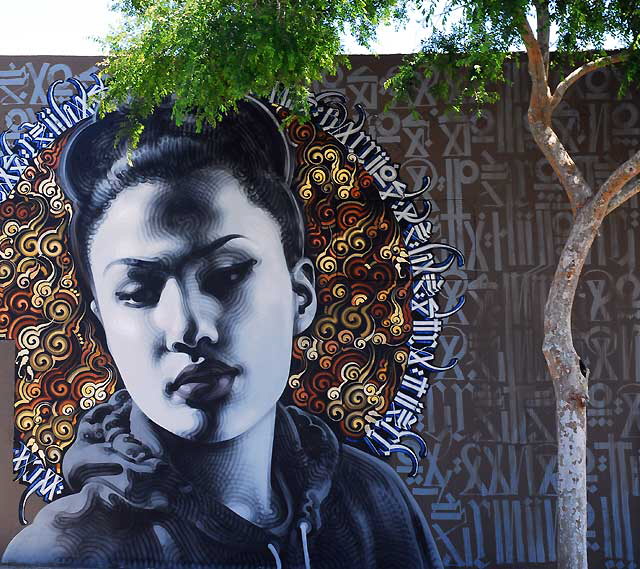 Thai Woman, graphic on the southeast corner of Hollywood Boulevard and Wilton 