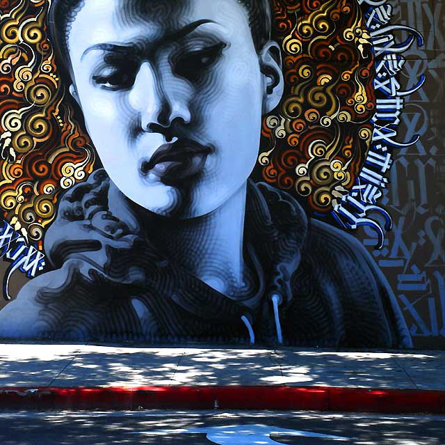 Thai Woman, graphic on the southeast corner of Hollywood Boulevard and Wilton 