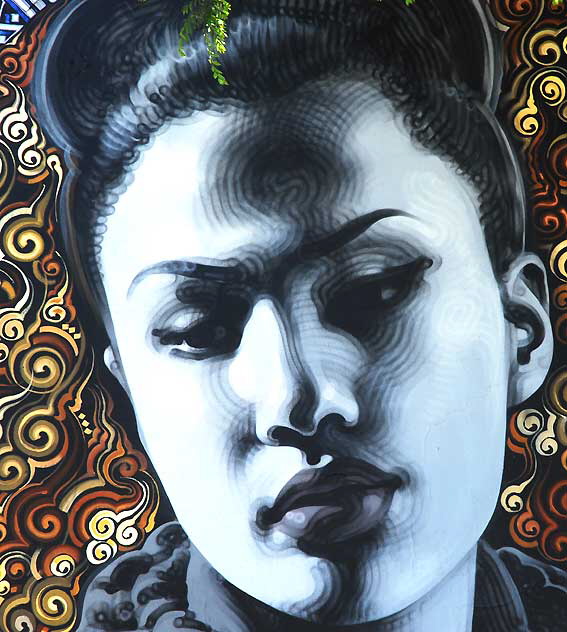 Thai Woman, graphic on the southeast corner of Hollywood Boulevard and Wilton 