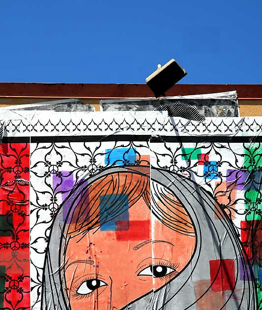 Poster of veiled woman at what used to be The Old Spaghetti Factory on Sunset 