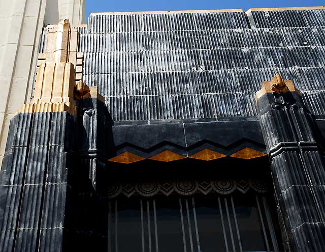 Security-First National Bank of Los Angeles branch at 5209 Wilshire Boulevard - listed on the National Register of Historic Places, built in 1929, the work of the architecture firm of Morgan, Walls and Clements - the last surviving example of Stiles O. Clements' black-and-gold terra cotta designs Security-First National Bank of Los Angeles branch at 5209 Wilshire Boulevard - listed on the National Register of Historic Places, built in 1929, the work of the architecture firm of Morgan, Walls and Clements - the last surviving example of Stiles O. Clements' black-and-gold terra cotta designs