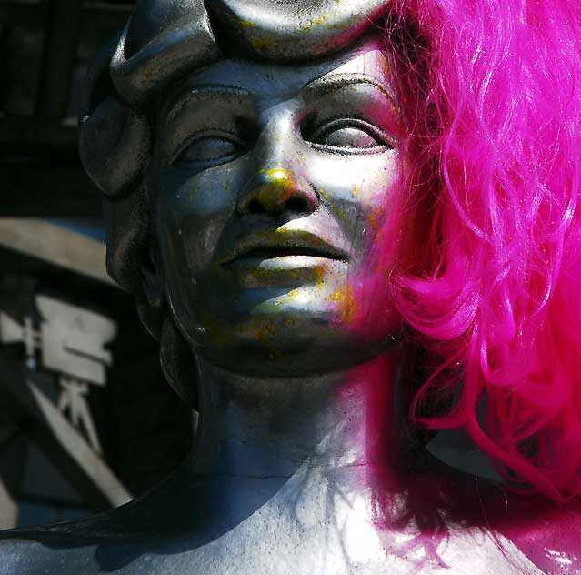 Mae West, with pink wig, Hollywood Gateway at Hollywood and La Brea