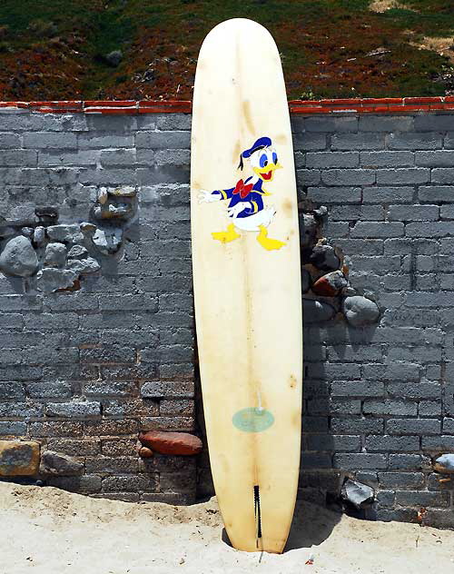 Donald Duck surfboard at "The Wall" at Surfrider Beach, Malibu
