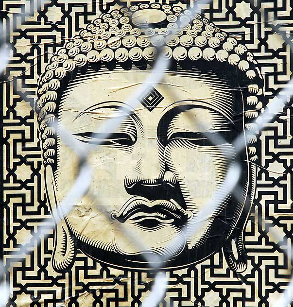 Buddha behind chain link fence, West Sunset Boulevard, Sunset Junction 