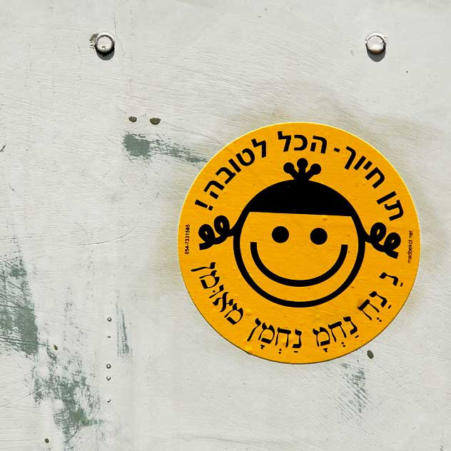 Yellow Smile in Pigtails, sticker in utility box, Oakwood Avenue at La Brea